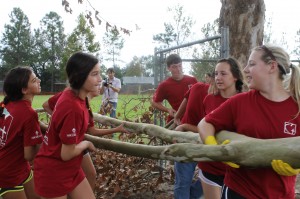 Youth volunteers helping clean up debris at Ascension of Our Lord School in La Place as part of the CCANO Volunteer Day on 9/8 