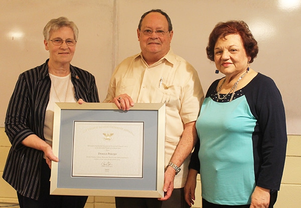 Sr. Marjorie Hebert, President/CEO of Catholic Charities, with Danilo Perojo, recipient of the President's Lifetime Achievement Award for National Service, with wife.