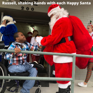 Russell shaking hands with each Happy Santa